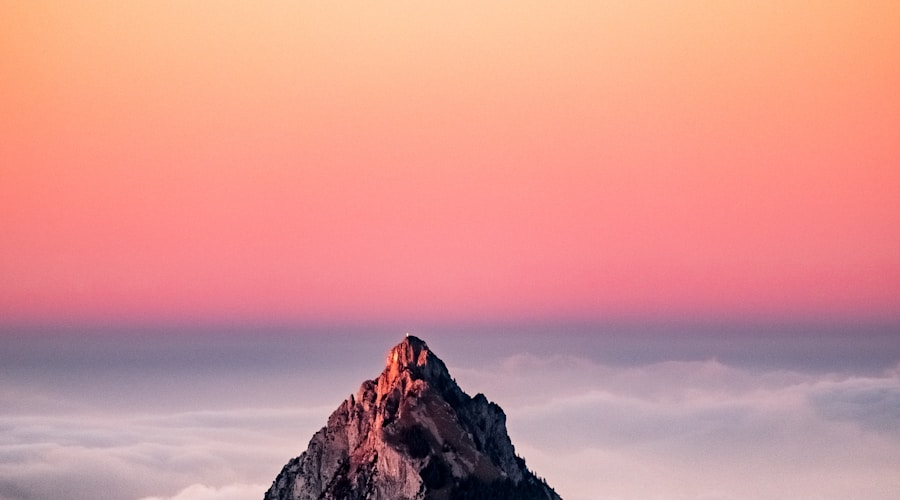 Small marina with wooden docks, a few boats, and a modest harbour building