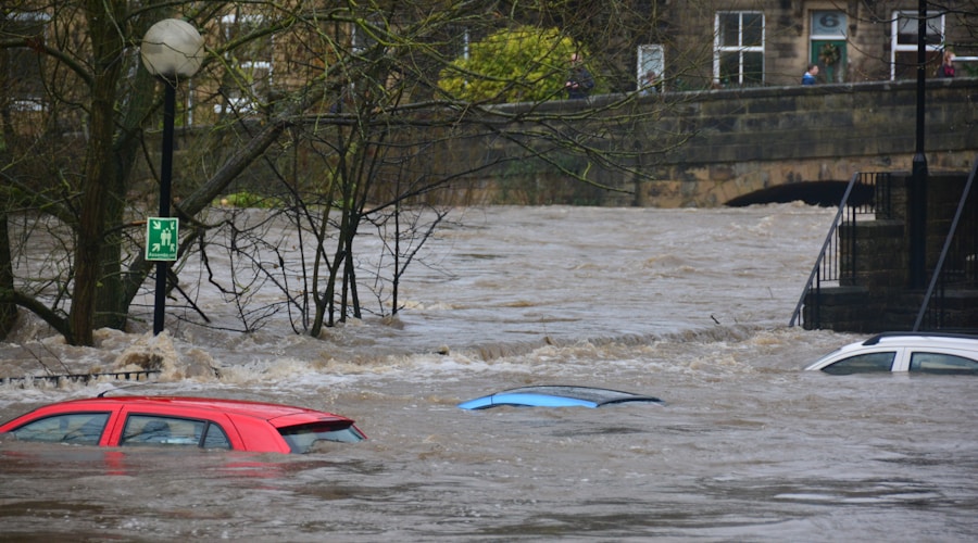 A river town experiencing spring flooding with water over roads and into yards