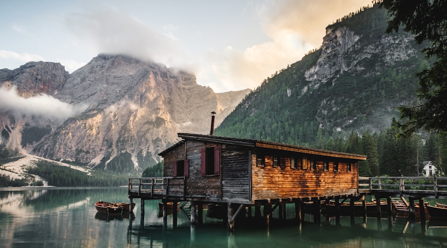 Cozy cabin on a frozen lake shore during winter